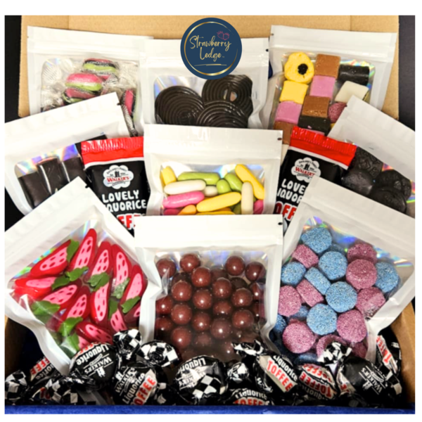 Open liquorice sweets gift box showing multiple pouches and wrapped sweets inside